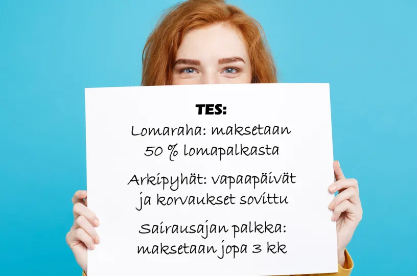 nainen pitelee kylttiä jossa teksti tes